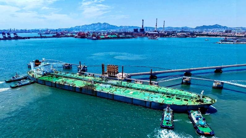 A ship loaded with oil docks at the port of Qingdao, in eastern China’s Shandong province.