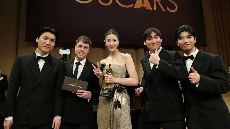 HOLLYWOOD, CALIFORNIA - MARCH 15: (L-R) ZHUN, Mark Sonnenblick, EJAE, NHD and Yuhan, winners of Music (Original Song) award for "Golden" from “KPop Demon Hunters" attend the 98th Oscars Governors Ball at Ovation Hollywood Complex on March 15, 2026 in Hollywood, California. (Photo by Arturo Holmes/Getty Images)