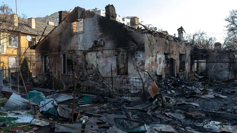 People stand at the site of a destroyed building follwong a Russian air attack, in Odesa on March 28, 2026, amid the Russian invasion of Ukraine. One person was killed and 11 others were wounded, including a child, after residential buildings and a maternity hospital were struck in Ukraine's Odesa region, authorities said Saturday. (Photo by Oleksandr GIMANOV / AFP)