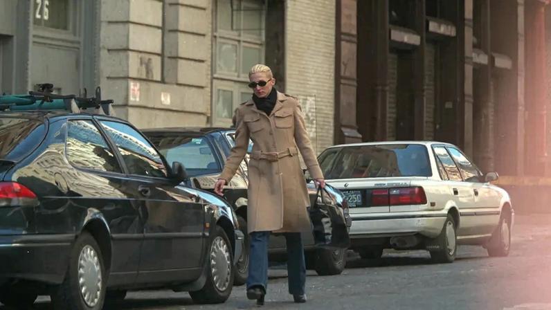 Carolyn Bessette Kennedy’s camel Prada coat — seen here in a 1997 paparazzi shot — sold for a record $192,000 at auction in March.