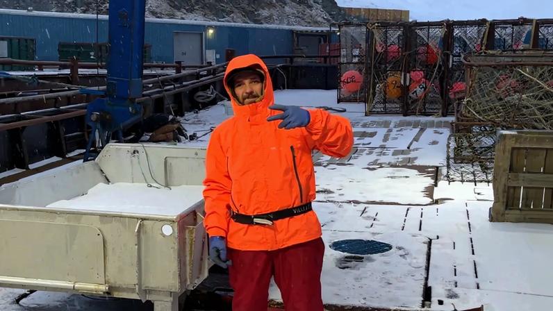 Todd Meadows, of Deadliest Catch, standing on a snow-covered deck.