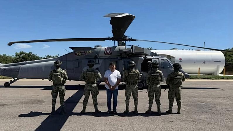 Mexican special forces members escort Audias Flores, ‘El Jardinero’, in Nayarit, Mexico, in this handout distributed on 27 April 2026.