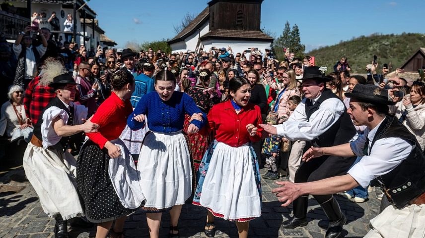 Young men and young women in folk costumes participate in the Easter folk festival in the village of Holloko, a UNESCO World Heritage site, in northeastern Hungary