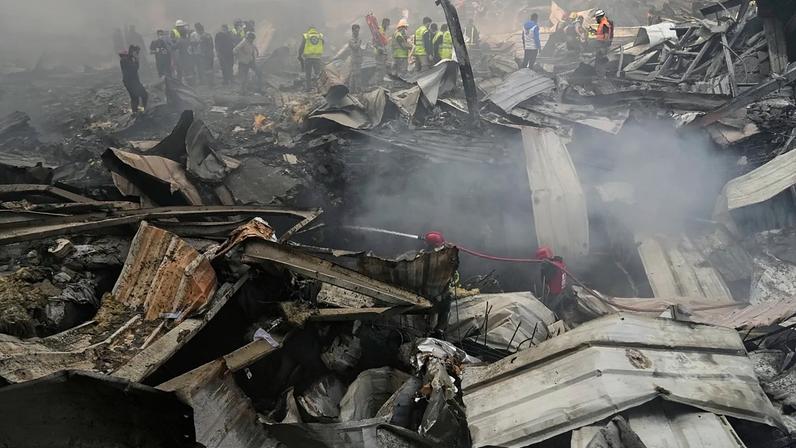 First responders work at the site of an Israeli airstrike that struck an apartment building in Beirut, Lebanon