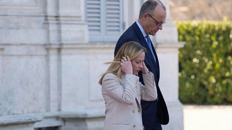 Italian Premier Giorgia Meloni welcomes German Chancellor Friedrich Merz at an intergovernmental summit at Villa Doria Pamphilj in Rome, Friday, Jan. 23, 2026.