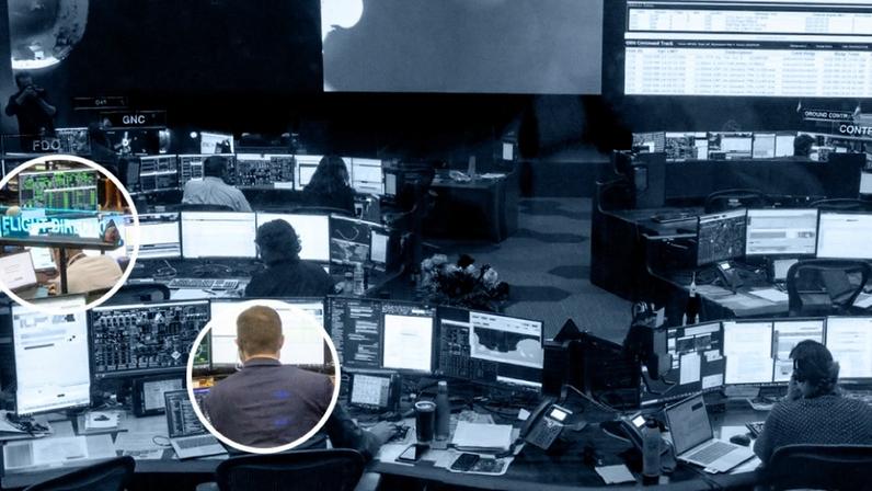 Inside mission control, each desk, or console, is labeled with a neon blue sign and its officers handle a subsystem on the spacecraft carrying the Artemis II crew.