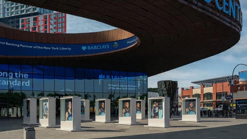 LaToya Ruby Frazier's The Liberty Portraits: A Monument to the 2024 Champions (2025)—with Ursula von Rydingsvard's Ona (2013) behind—on the Barclays Center plaza in Brooklyn last year