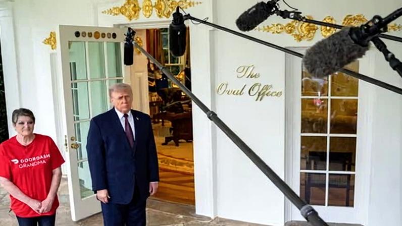 Donald Trump with DoorDash worker Sharon Simmons at the White House, Washington, 13 April 2026.