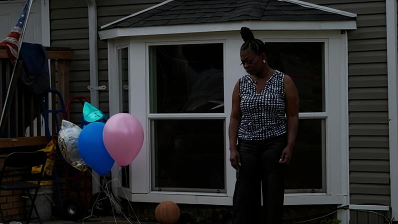 A makeshift memorial with balloons and stuffed animals outside the house where the shooting took place in Shreveport, Louisiana.