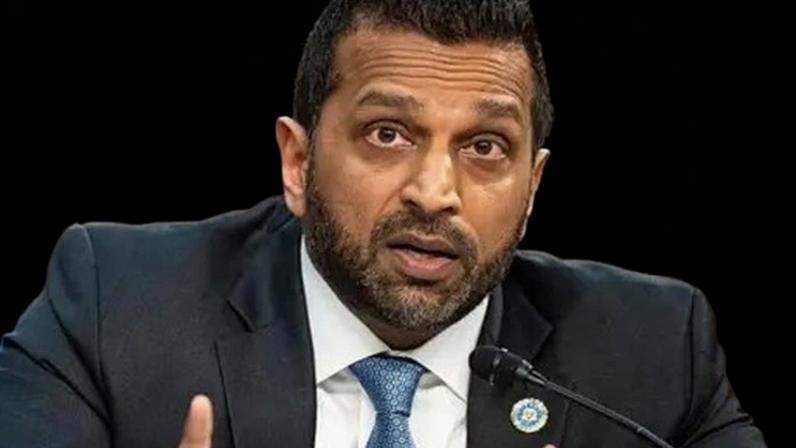 Getty Images FBI Director Kash Patel at a congressional hearing. He wears a suit with a blue patterned tie and a lapel pin.