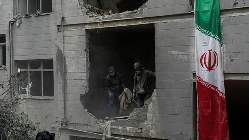 People clear rubble in a house in the Beryanak district 15 March 2026 after it was damaged by missile attacks in Tehran, Iran.