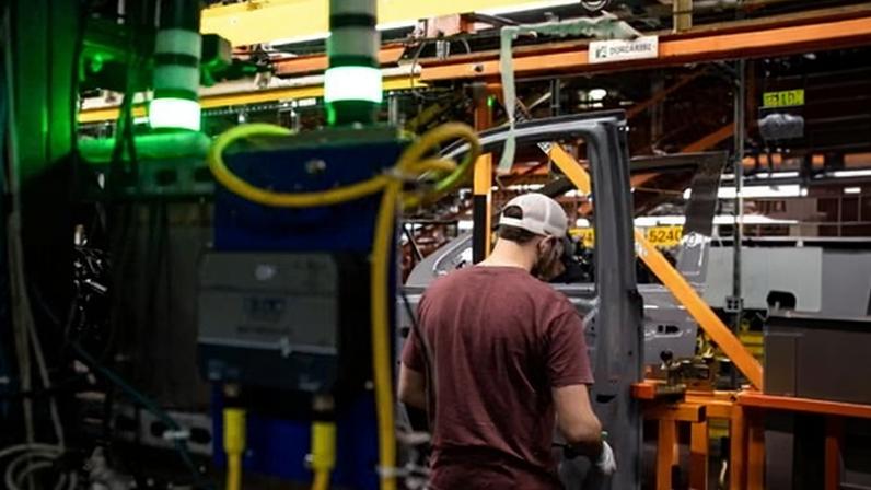 A worker assembles vehicle doors at the General Motors assembly plant in Fort Wayne, Indiana, in 2024.