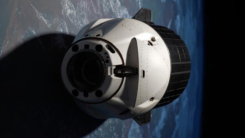 A SpaceX Dragon cargo spacecraft with its nosecone open and carrying over 5,000 pounds of science, supplies, and hardware as NASA's SpaceX CRS-33 mission approaches the International Space Station for an automated docking to the Harmony module's forward port. Both spacecraft were flying 259 miles above western Mauritania near the Atlantic coast at the time of this photograph.