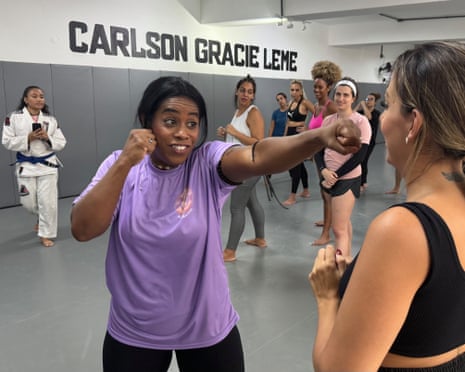 Ana Paula Lima, right, teaches muay thai in Rio de Janeiro.