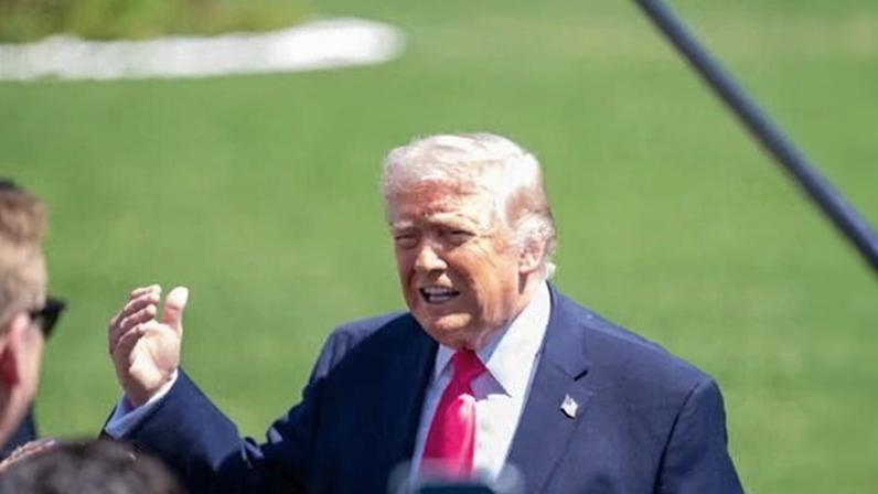President Trump takes questions from the media before he boards his helicopter in Washington, DC.