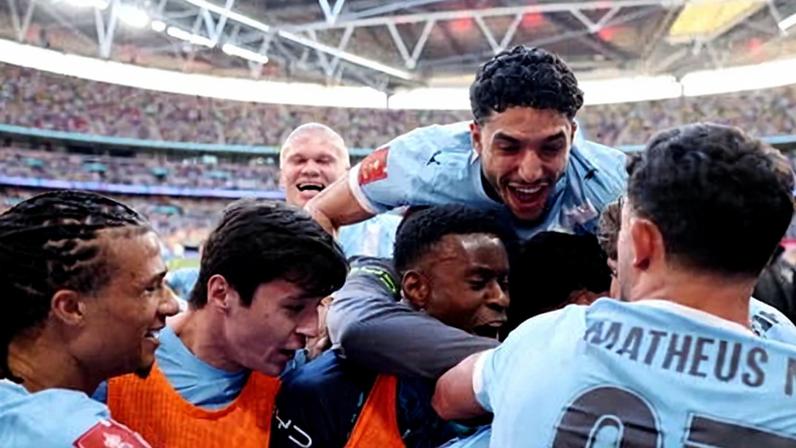 Manchester City players get their celebrations on.