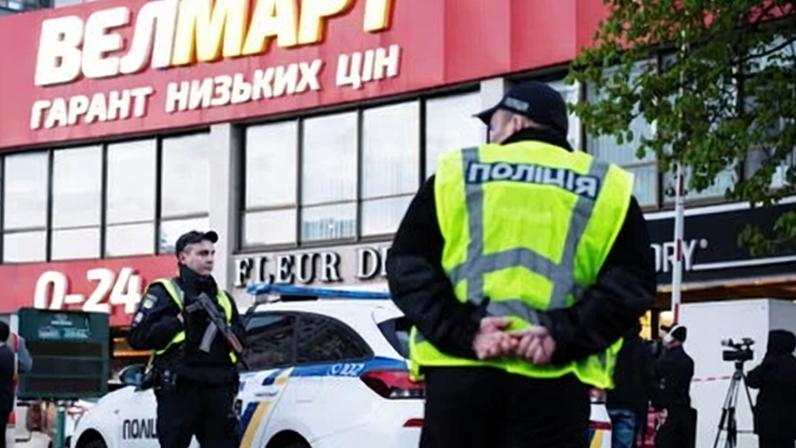 Police secure the scene after a man shot six people dead in Kyiv, Ukraine, on Saturday.