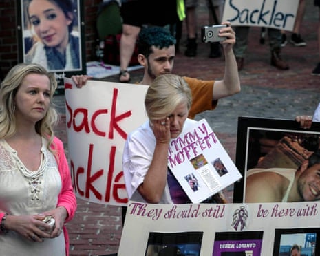 Protesters who have lost love ones to the opioid crisis outside a courthouse in Boston on 2 August 2019.