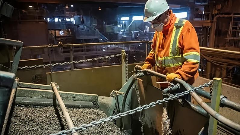 AFP via Getty Images An employee works in the Northern Graphite mine plant in Lac-des-Îles, Quebec