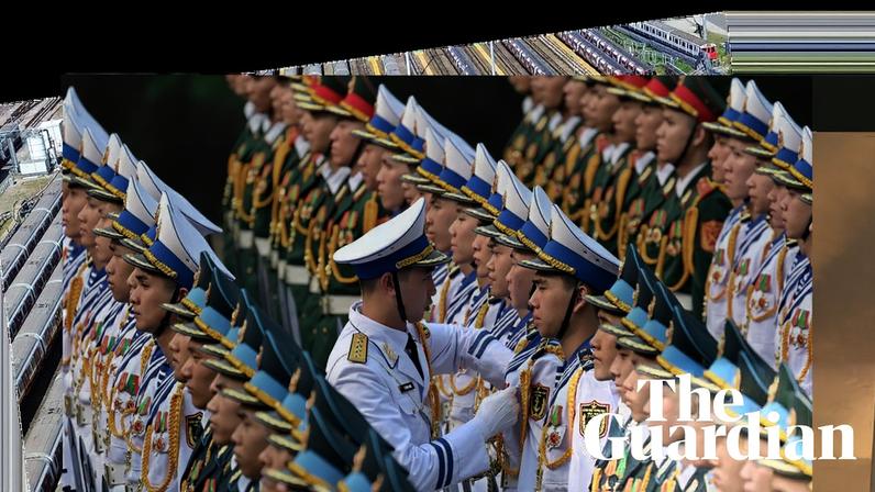 Rows of guards, dressed either in green uniforms and hats or white uniforms and hats