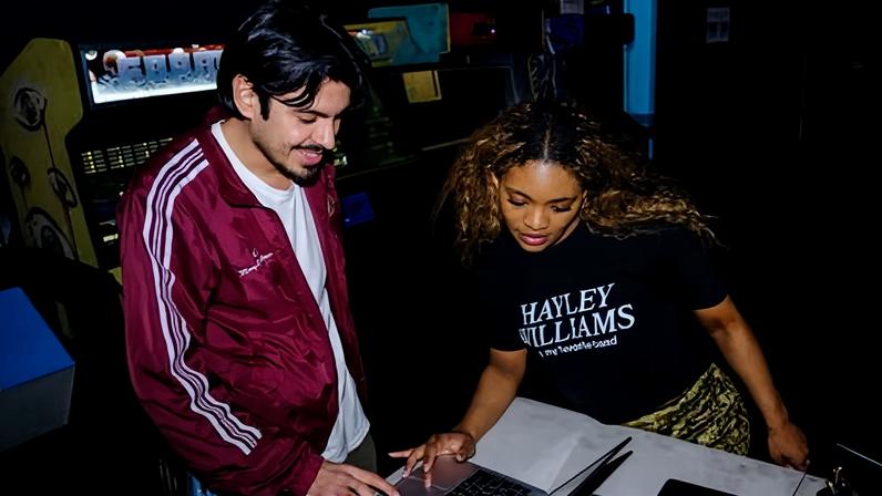 Imani Thompson helps a Break Up With Google event attender at Wonderville Bar in Brooklyn on Tuesday.