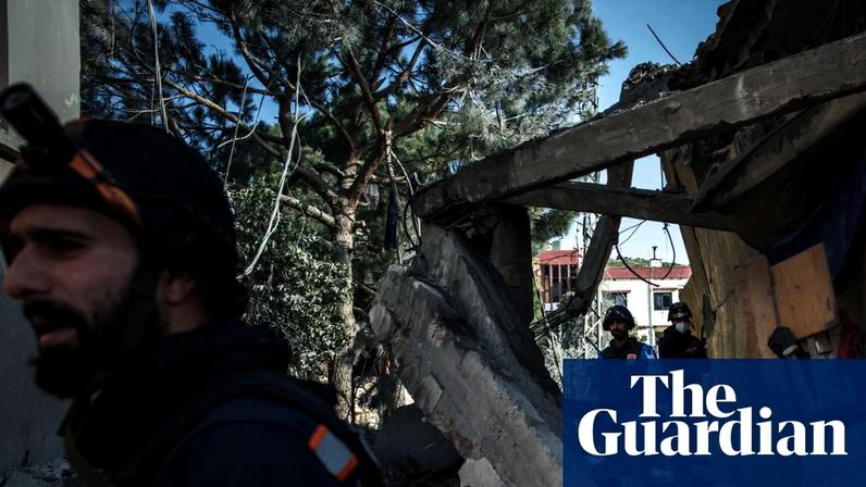Paramedics search a building for survivors in Nabatieh on Monday, shortly after an Israeli airstrike.