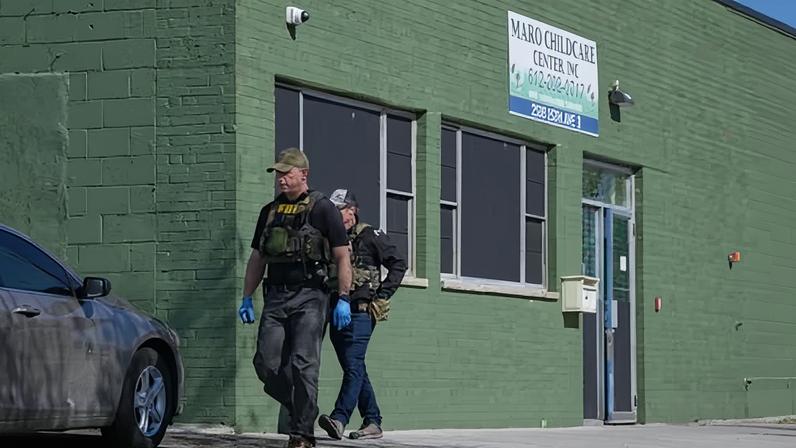 FBI agents walk outside the Mako childcare center in Minneapolis, Minnesota on 28 April 2026.