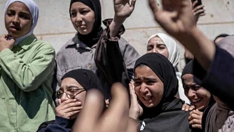 Family and friends mourn the death of Aws al-Naasan, 14, during his funeral in al-Mughayyir, north-east of Ramallah, on Wednesday.