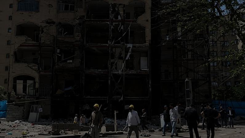 People work around a destroyed residential building which was destroyed by US-Israeli airstrikes at the Shahid Broujerdi residential complex in southern Tehran, Iran, 14 April 2026.