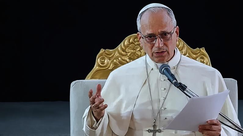 Reuters Pope Leo speaks at a podium.