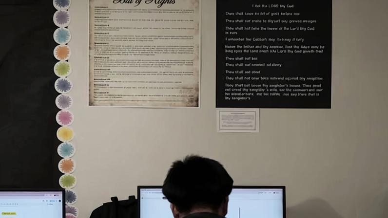 Students work under Ten Commandments and Bill of Rights posters on display in Kyle, Texas, on 16 October 2025.