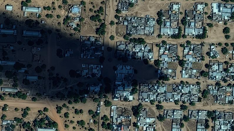 A satellite view of El-Fasher after Rapid Support Forces fighters seized the city; fires and smoke billow around the city’s airport.