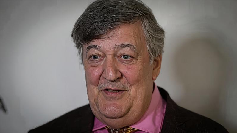 Getty Images Sir Stephen Fry in a pink shirt, gold tie and maroon jacket, at the premiere of Treasure during the 2024 Tribeca Festival