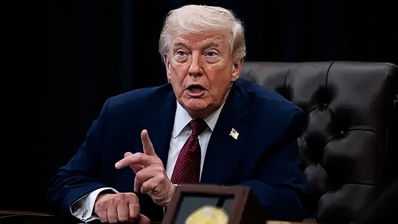 Getty Images Trump points his finger as he speaks in the Oval Office with his supporters standing behind him