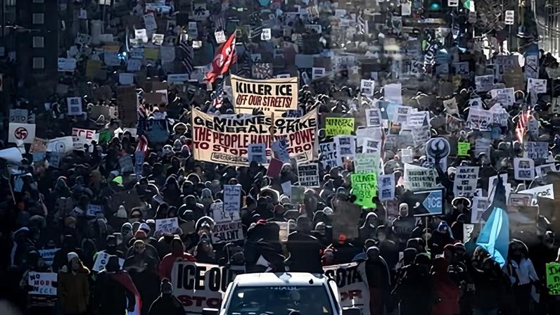 Protesters against Immigration and Customs Enforcement (ICE) march through the streets of downtown Minneapolis on 25 January.