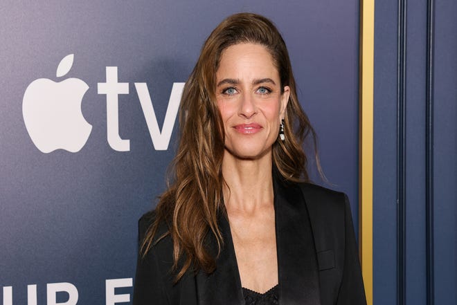 Amanda Peet, seen at the New York premiere of Apple TV+'s "Your Friends & Neighbors" on April 8, 2025, says she is going through perimenopause at the same time as her TV show character.