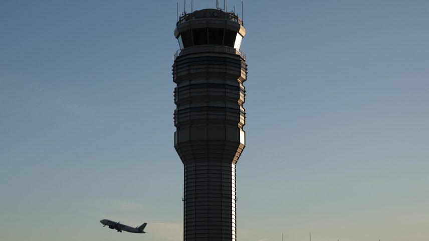The control tower stands at Ronald Reagan Washington National Airport as a plane takes off on October 27, 2025 in Arlington, Virginia.