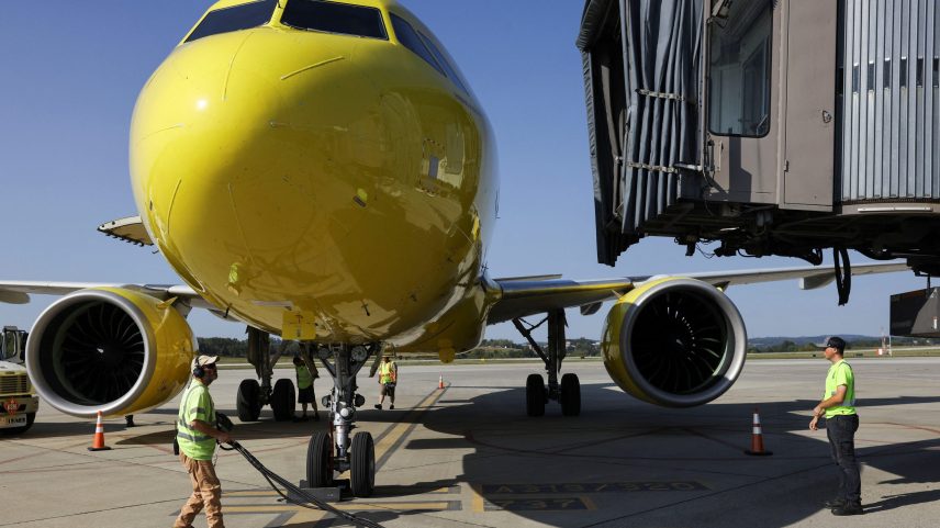Airport employees work on the tarmac as a Spirit Airlines flight arrives at Arnold Palmer Regional Airport in Westmoreland County, Pennsylvania, U.S., September 18, 2025.