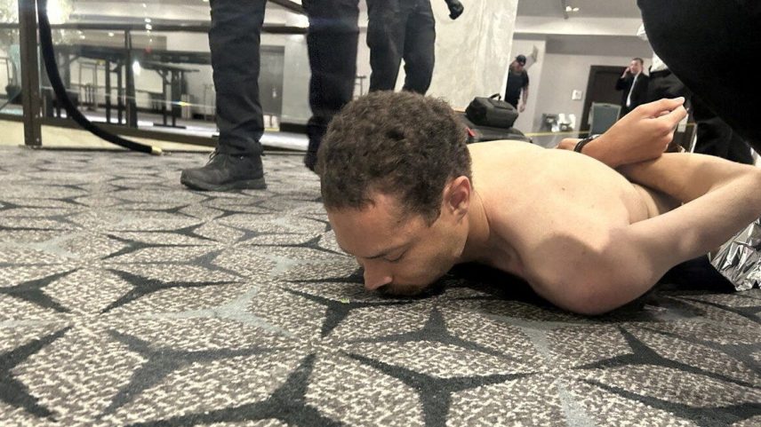 Law enforcement personnel detain Cole Tomas Allen, a suspect in the shooting incident at the White House Correspondents' Association dinner, in Washington, D.C., U.S. April 25, 2026.
