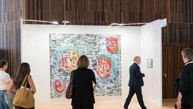 Visitors to Art Cologne Palma Mallorca, standing in front of Georg Baselitz's *Horta de Ebro* (1988), shown at THK gallery
