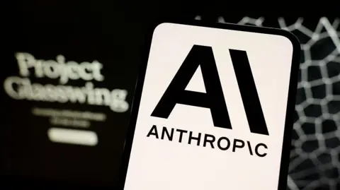 Getty Images A phone screen with the Anthropic logo on it in black and white.