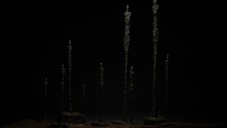 Giacometti, *La Clairière (Composition avec neuf figures)*, conceived in 1950 and cast in 1960.