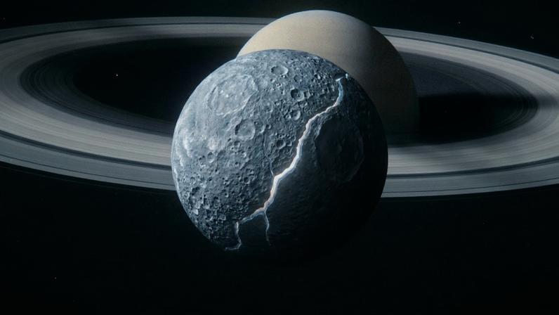 Oceano global de água líquida detectado sob a superfície cheia de crateras da lua Mimas