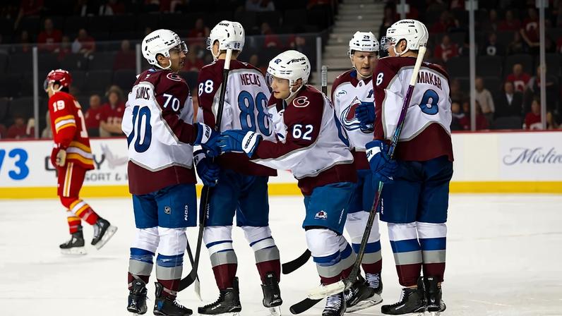 CALGARY, CANADA - APRIL 14: Artturi Lehkonen #62 of the Colorado Avalanche celebrates with Sam Malinski #70, Martin Necas #88, Nathan MacKinnon #29 and Cale Makar #8 of the Colorado Avalanche after scoring a goal against the Calgary Flames during the second period at the Scotiabank Saddledome on April 14, 2026 in Calgary, Canada. (Photo by Brett Holmes/Getty Images)