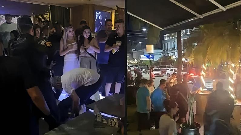 Policiais chegam após confusão em bar e socorrem homem baleado na Barra da Tijuca.