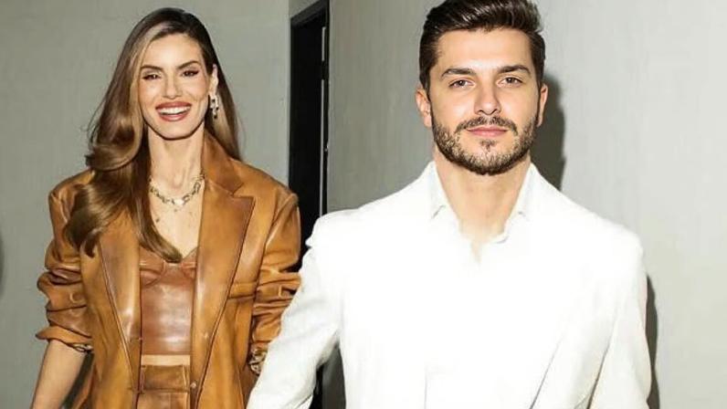 Klebber Toledo posatr com bebê em aeroporto do Rio