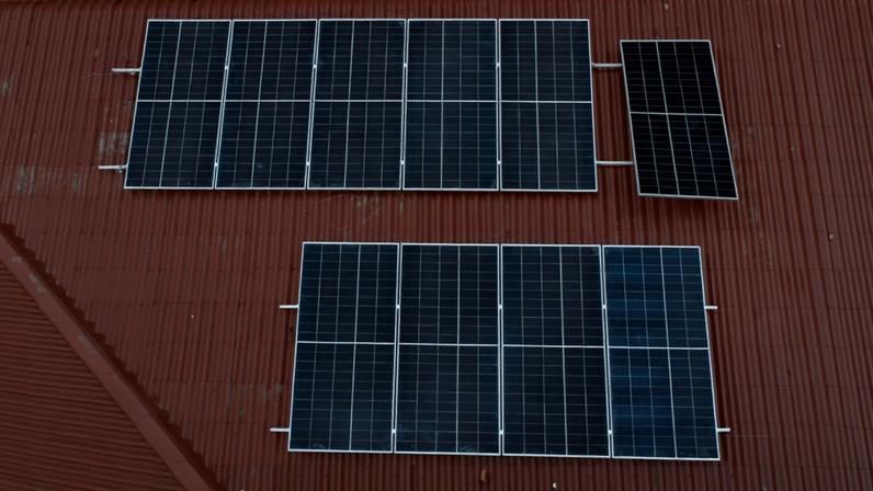 A solar power plant installation for a mosque. Image by Jaka Hendra Baittri/Mongabay Indonesia.