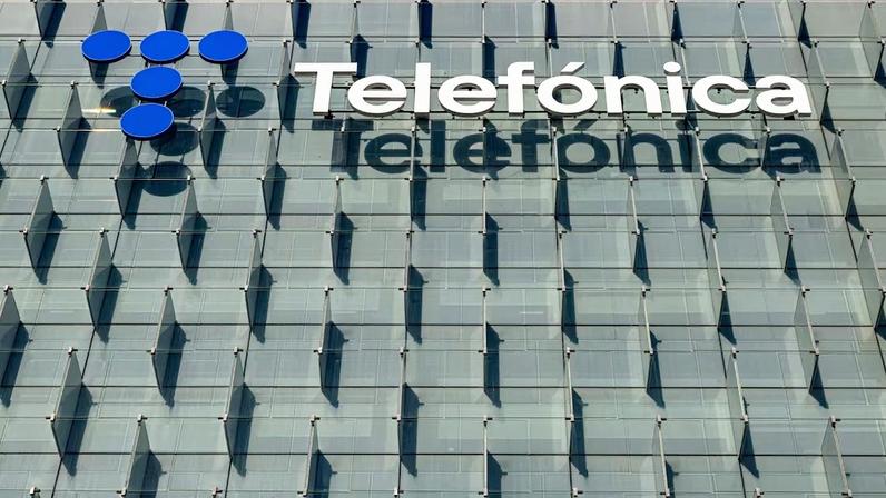 A Telefonica SA sign outside the company's headquarters in Madrid, Spain, on Thursday, Nov. 27, 2025. Telefónica, Spain’s largest telecommunications company by revenue, plans to eliminate 6,088 jobs in the country as part of a sweeping cost-cutting drive.