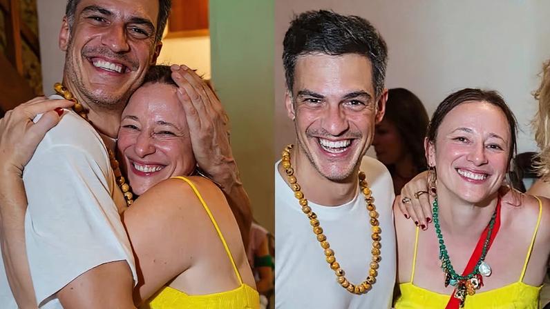 Mateus Solano e Paula Braun posam abraçados no aniversário da atriz