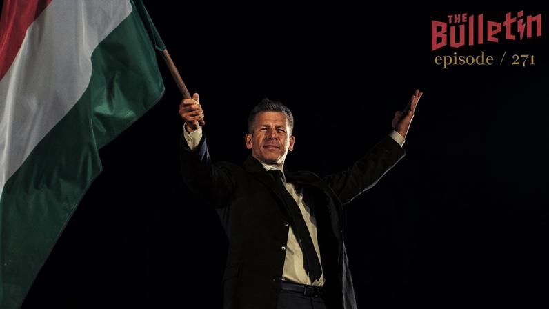 Prime minister elect Peter Magyar holding the Hungarian flag.